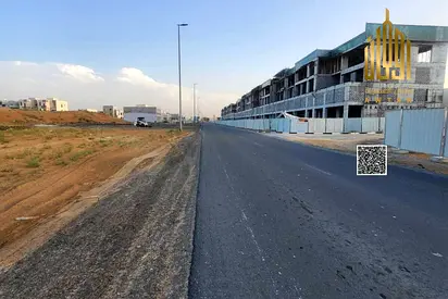 Commercial land on a main street, fees included