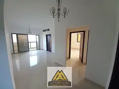 Two bedrooms and a large living room with a balcony in the Al-Aliya area, next to Mohammed Bin Zayed