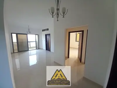 Two bedrooms and a large living room with a balcony in the Al-Aliya area, next to Mohammed Bin Zayed Road and all services.