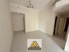 2BR hall Al Nuaimiya 1 Ajman, balcony, 2 baths, central AC, prime location, 34k yearly, 4 payments.