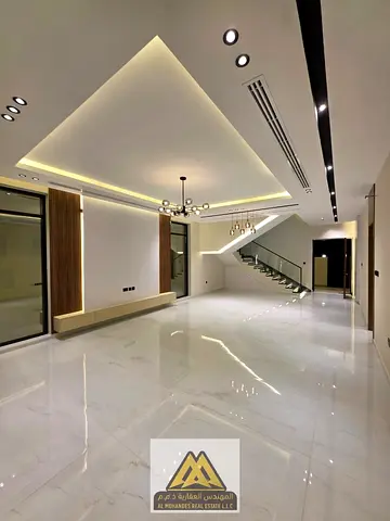 Annual villa for rent in Al Helio, Ajman. Two floors plus a rooftop, featuring 5 bedrooms and a private swimming pool. Modern design, premium finishes