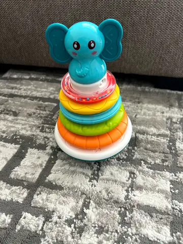 Baby stacking rings toy with elephant topper - used- battery required the cover is broken