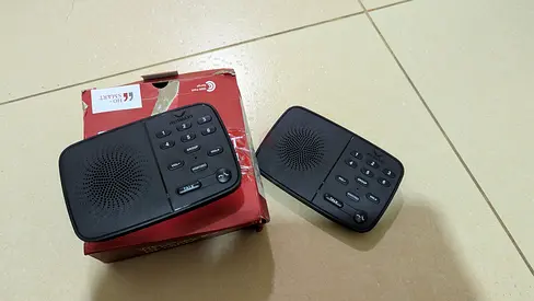 Pair of portable tabletop speakers with caller ID / intercom-style keypad