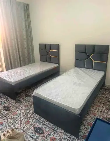 Pair of single upholstered beds with headboards - grey