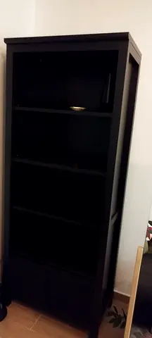 1x Tall black wooden bookcase with 4 shelves and storage cabinet