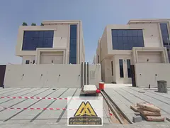 A villa is available for sale in Al Helio, Ajman, featuring a modern design and spacious layout, ide