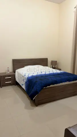 Wooden double bed with mattress and bedside table - lightly used