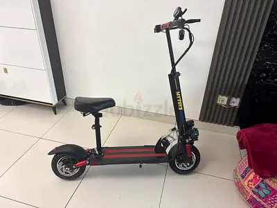 Electric scooter with seat - sturdy dual suspension, ready to ride