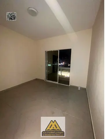 2BR apartment Al Nuaimiya 1 2 baths closed kitchen balcony central AC 32K yearly 4 payments prime location ready to move in close to services