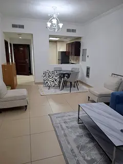A fully furnished one-bedroom with a living room in Al Jurf 2 – Yasmin Towers, next to City Centre