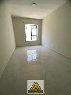 A spacious bedroom and living room with a practical design and ample space