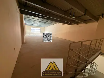 a mezzanine-level warehouse with ample space in a vibrant industrial area, providing an ideal environment for operations, storage, and business growth