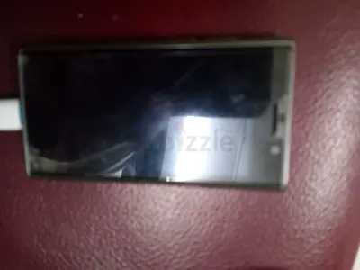 Used Sony Xperia smartphone - needs charging, screen has light scratches