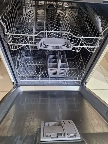 Used built-in stainless steel dishwasher with racks and cutlery basket