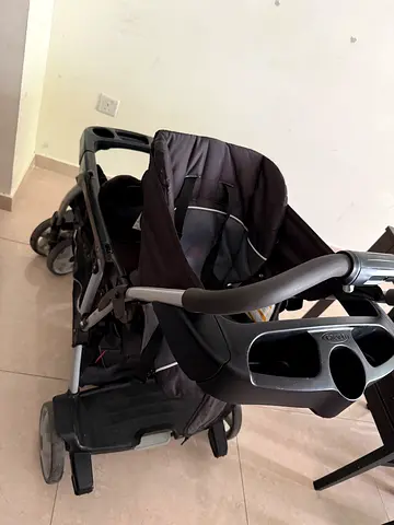 Graco double stroller with toddler seat and child board - good condition