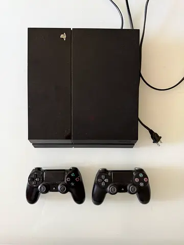 Sony PlayStation 4 with 2 Controllers - Good Working Condition