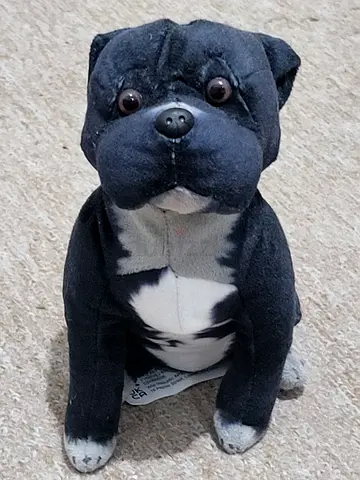 Black and white plush dog soft toy