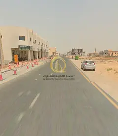 Commercial land for sale in Sharjah, Al Howshi (Al Badee Suburb), second row. Area: 6,006 square fee