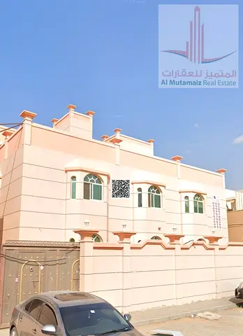 Two bedrooms, a living room, and two bathrooms in Al Rawda. Spacious area for families.