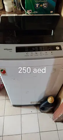 Used top-load washing machine - working, priced 250 AED