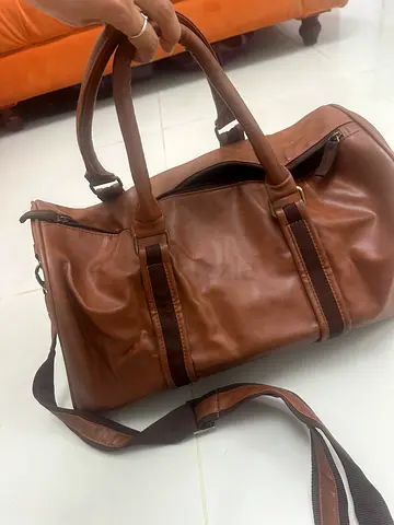 Brown leather duffel bag with shoulder strap - good condition