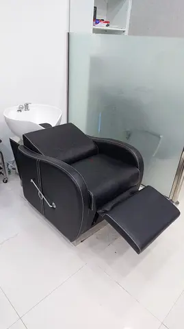 Black reclining salon shampoo chair with leg rest - good condition