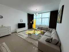 Two-bedroom apartment with a living room in Ajman - Corniche - Al Diwan Towers - furnished with hote