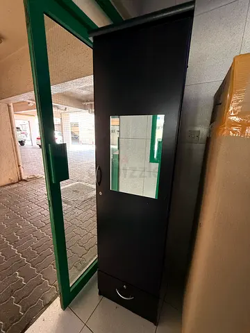Black single door wardrobe with mirror lockable drawer fully new condition