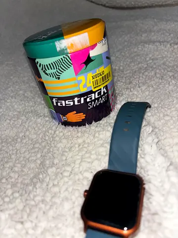 Fastrack smartwatch - with blue silicon strap and the charger in excellent condition.