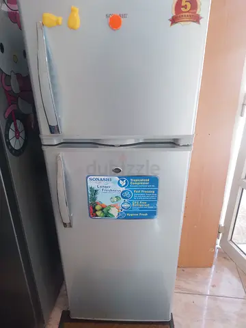Used double-door silver refrigerator, good working condition