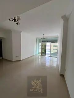 Two-bedroom apartment with a living room and balcony in Al-Taawun; features central air conditioning