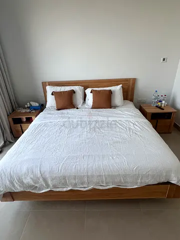Bedroom 4 pieces. King bed, 2 nightstands and dresser with mirror.