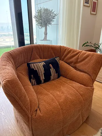 Comfortable single brown lounge chair -and statement chair