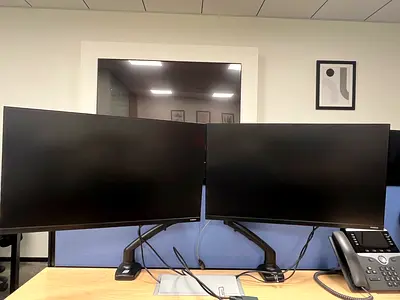 Office Clearance. Dual 24-27-inch Monitor Setup on Adjustable Arms (Office Ready)
