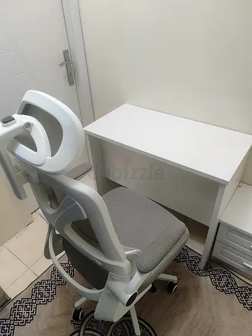 Compact white study desk with ergonomic office chair