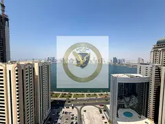 Two-bedroom apartment with a balcony and a full luxurious sea view in the finest towers of Sharjah,