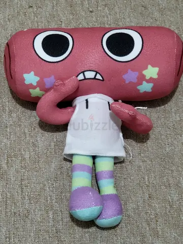 Cute pink plush character toy with star decorations - soft stuffed doll