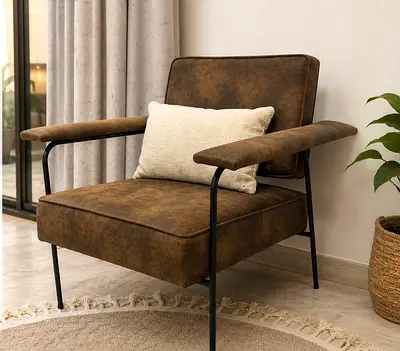 Brown leather-look lounge armchair with metal frame