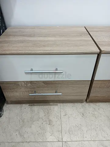 Pair of light oak bedside cabinets with two drawers (used)