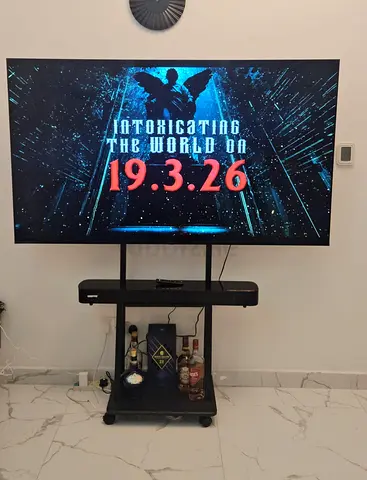 Geepas 75-inch LED Smart TV (6 months used) with simple stand and Geepas soundbar