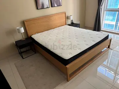 Selling luxury ikea bed with tow side table and with drawers table like new