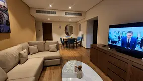 A beautiful two-bedroom apartment with a living room and parking in Al Taawun.