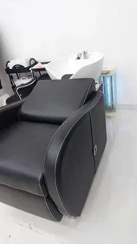 Black reclining salon shampoo chair with leg rest - good condition