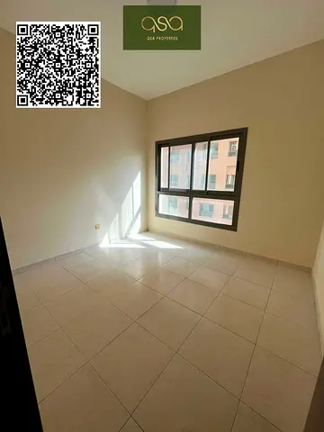 An Empty Two Bedroom Apartment With Parking Is Available For Rent In Paradise Lake Tower B5 Emirates City, Ajman!