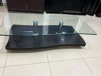 Coffee table - Dark wood and glass-good condition.