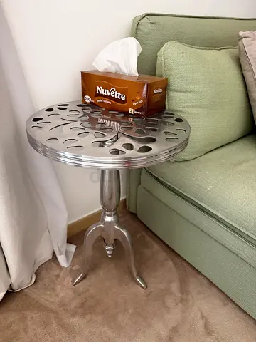 Small round metal side table with tripod base