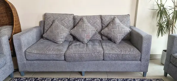 Two-seater light blue fabric loveseat in good condition