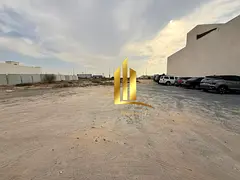 Commercial land for sale in Sharjah, Al-Hawshi, second row, Al-Badi' suburb, freehold ownership for
