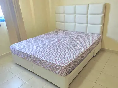 King size bed with padded faux leather headboard - excellent condition with Home centre mattress.