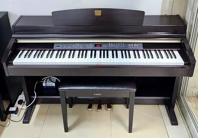 The Yamaha Clavinova CLP-230 is an 88-key digital piano designed for home practice and learning. It